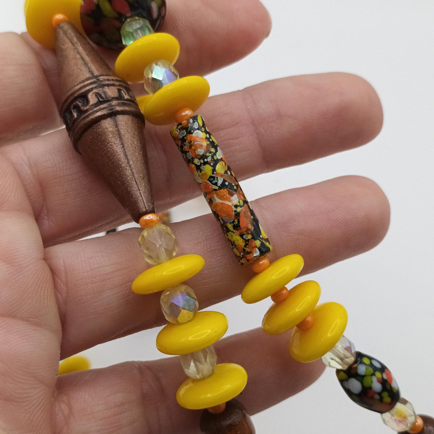 Yellow and bronze beaded necklace with hand painted glass beads.