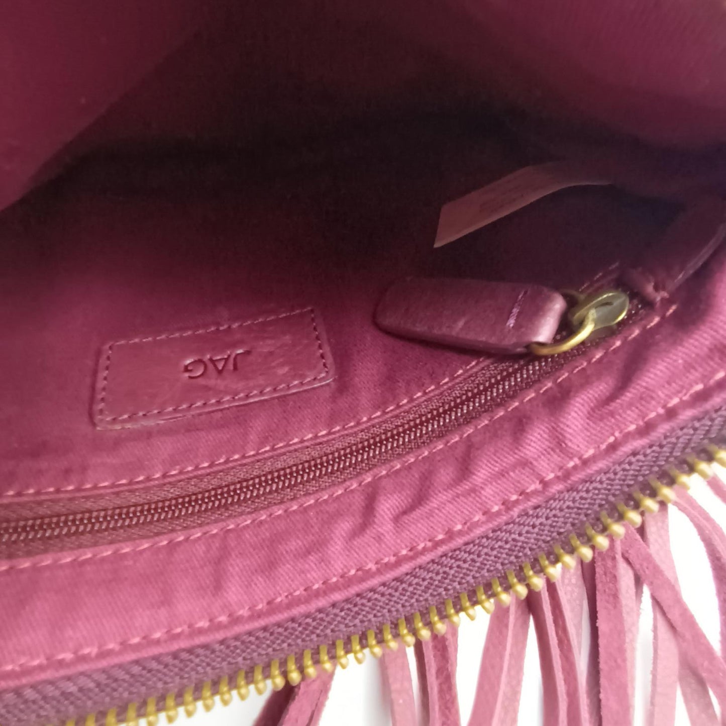Burgundy fringed leather clutch JAG
