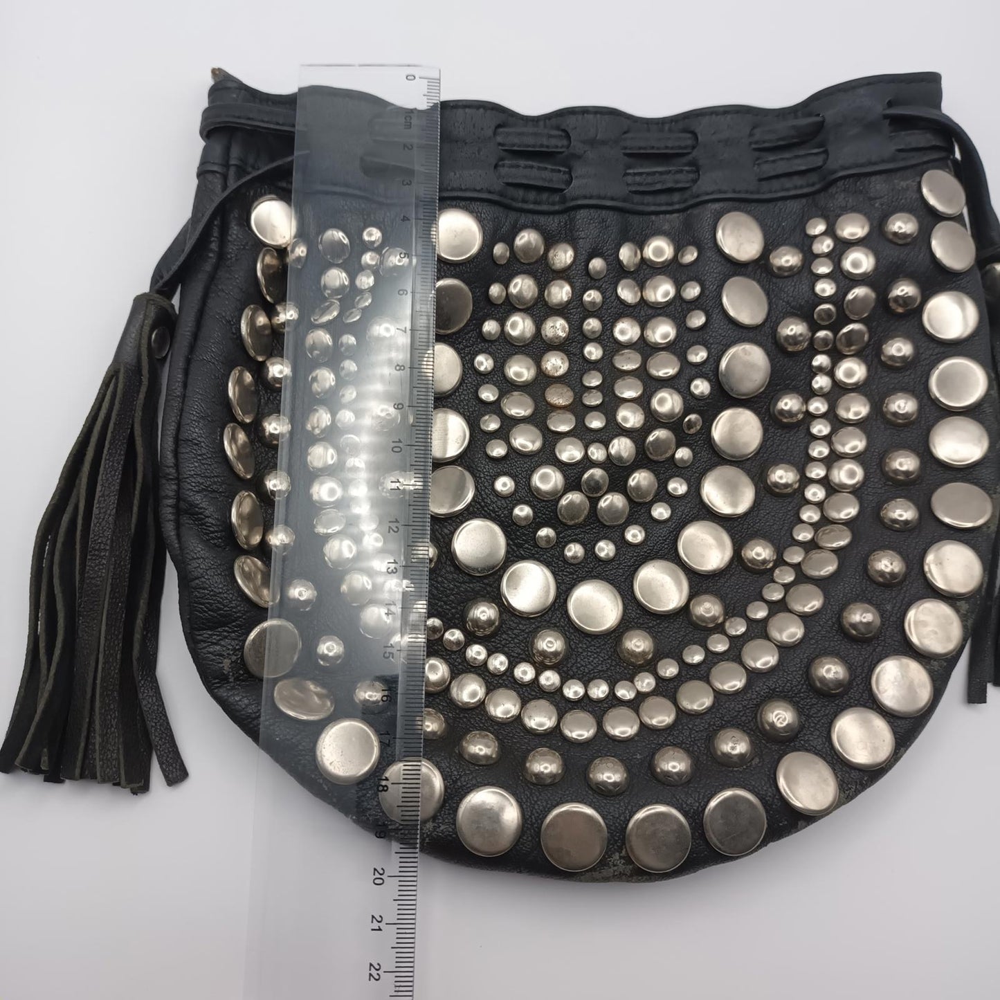Black leather studded fringed clutch bag