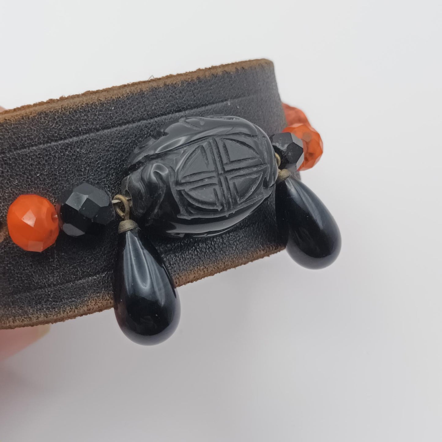 Vintage Handmade black leather cuff with black oriental stone embellishments.