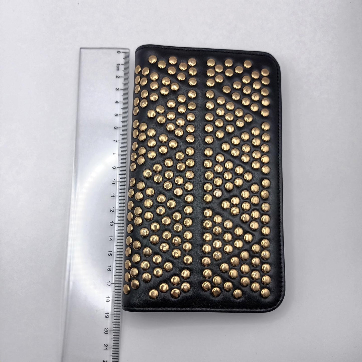 Leather Peeptoe gold studded wallet.