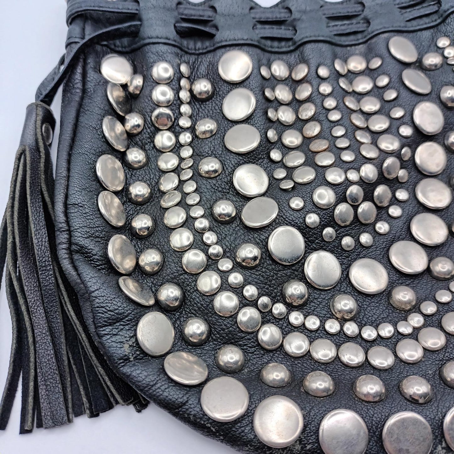 Black leather studded fringed clutch bag
