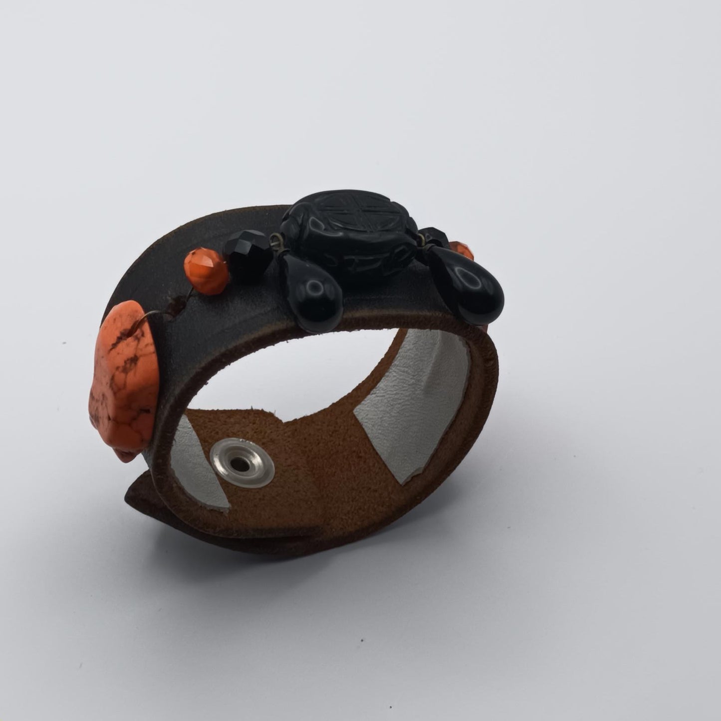 Vintage Handmade black leather cuff with black oriental stone embellishments.