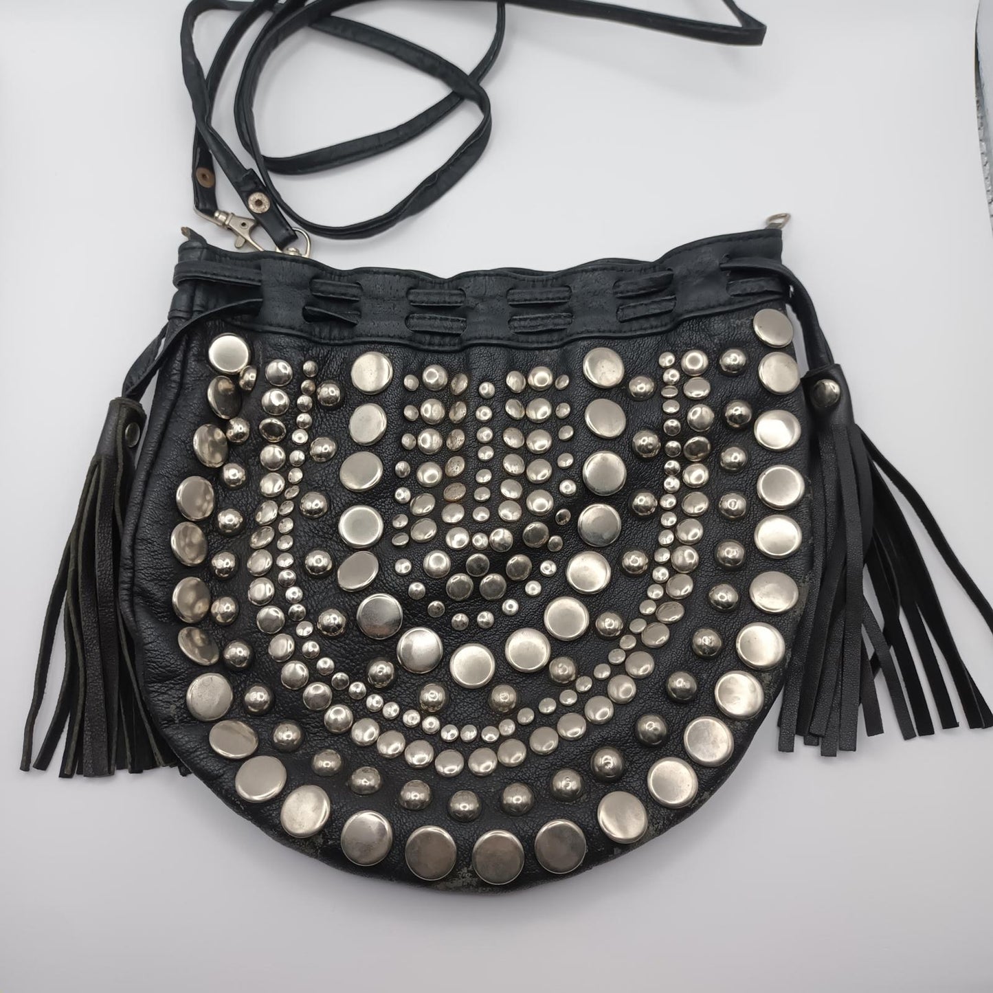 Black leather studded fringed clutch bag