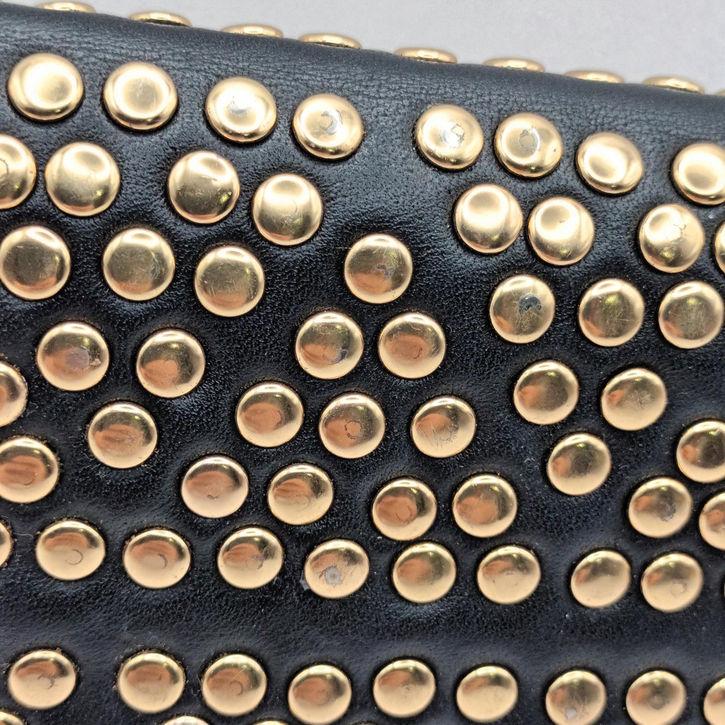 Leather Peeptoe gold studded wallet.