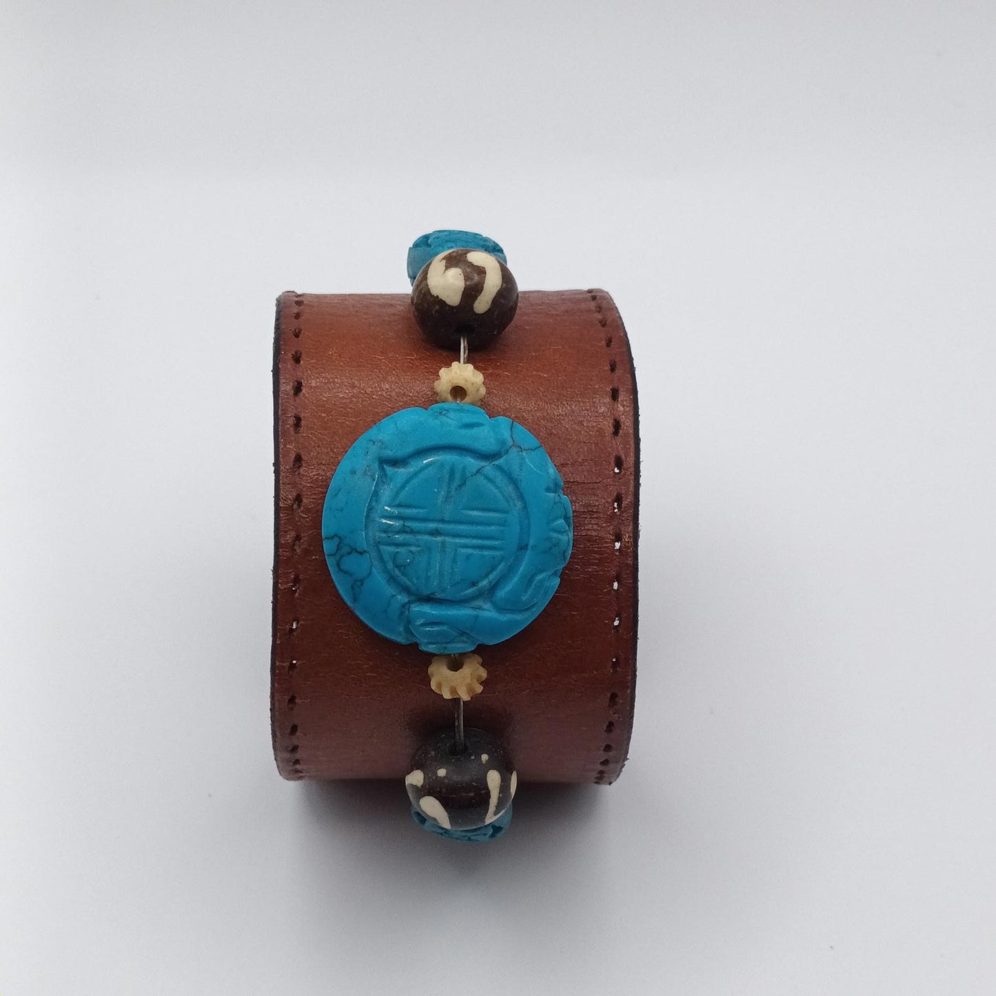 Vintage Handmade brown leather cuff with blue oriental stone embellishments
