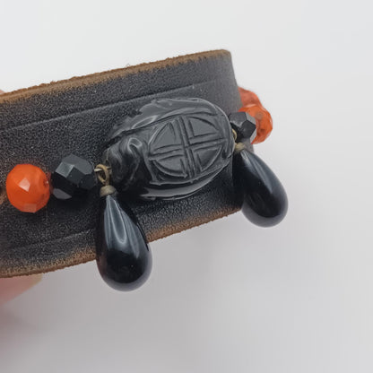 Vintage Handmade black leather cuff with black oriental stone embellishments.
