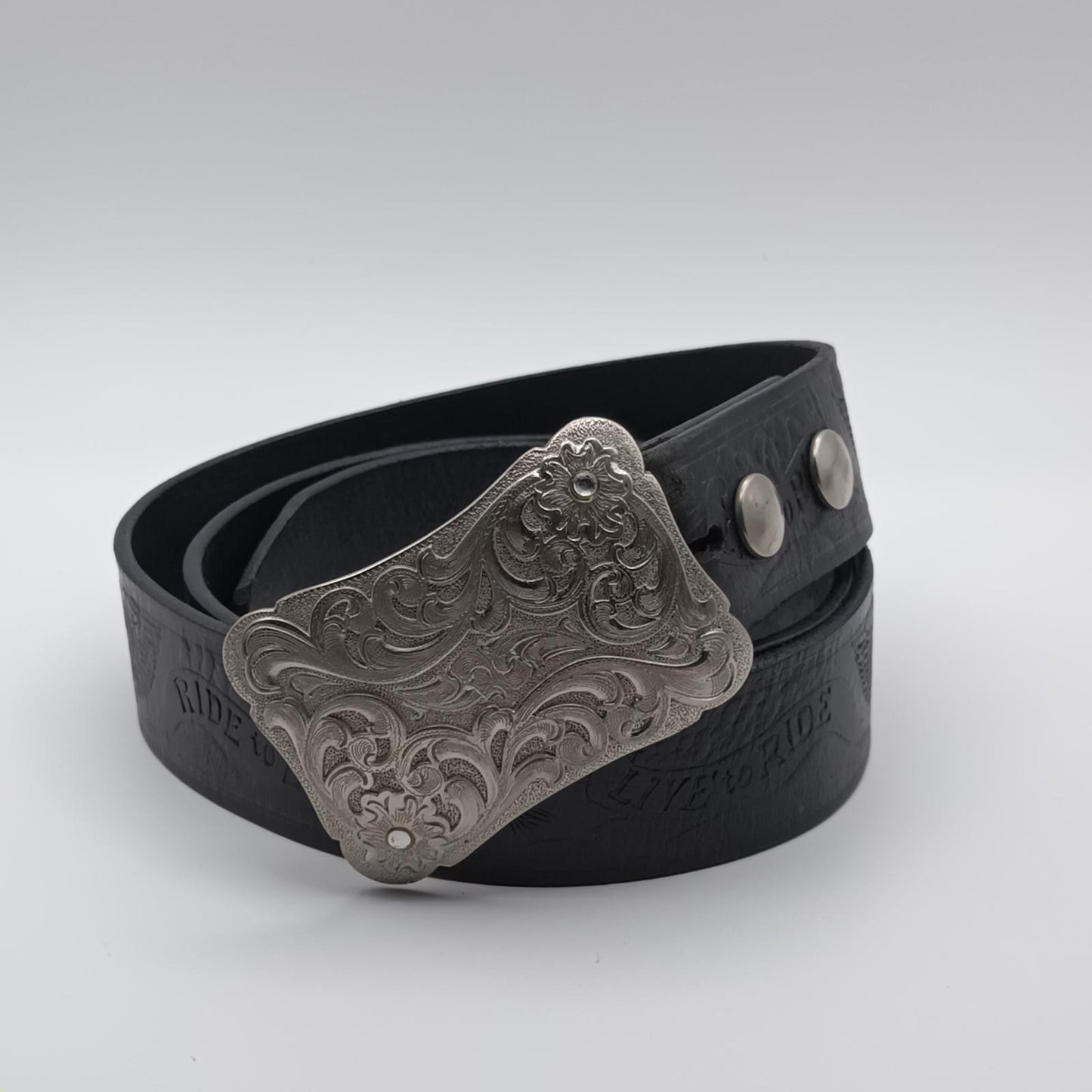 Vintage black tooled leather Live to ride silver buckled belt.