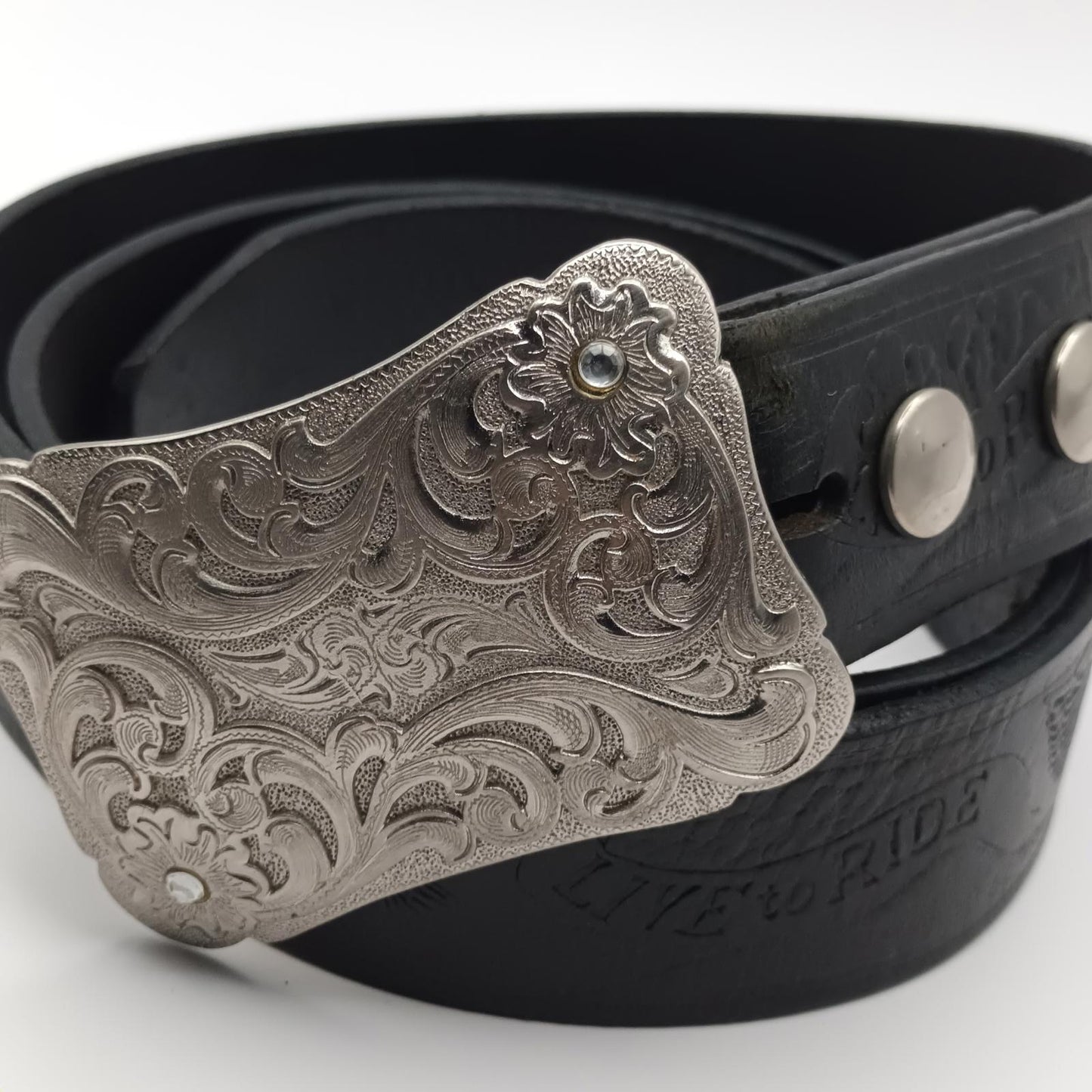 Vintage black tooled leather Live to ride silver buckled belt.