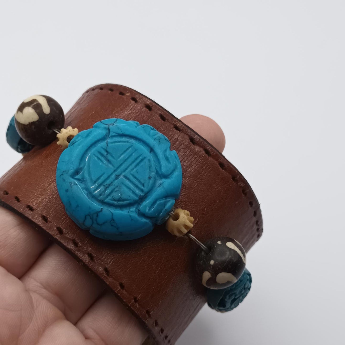 Vintage Handmade brown leather cuff with blue oriental stone embellishments