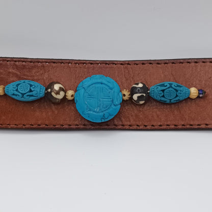 Vintage Handmade brown leather cuff with blue oriental stone embellishments