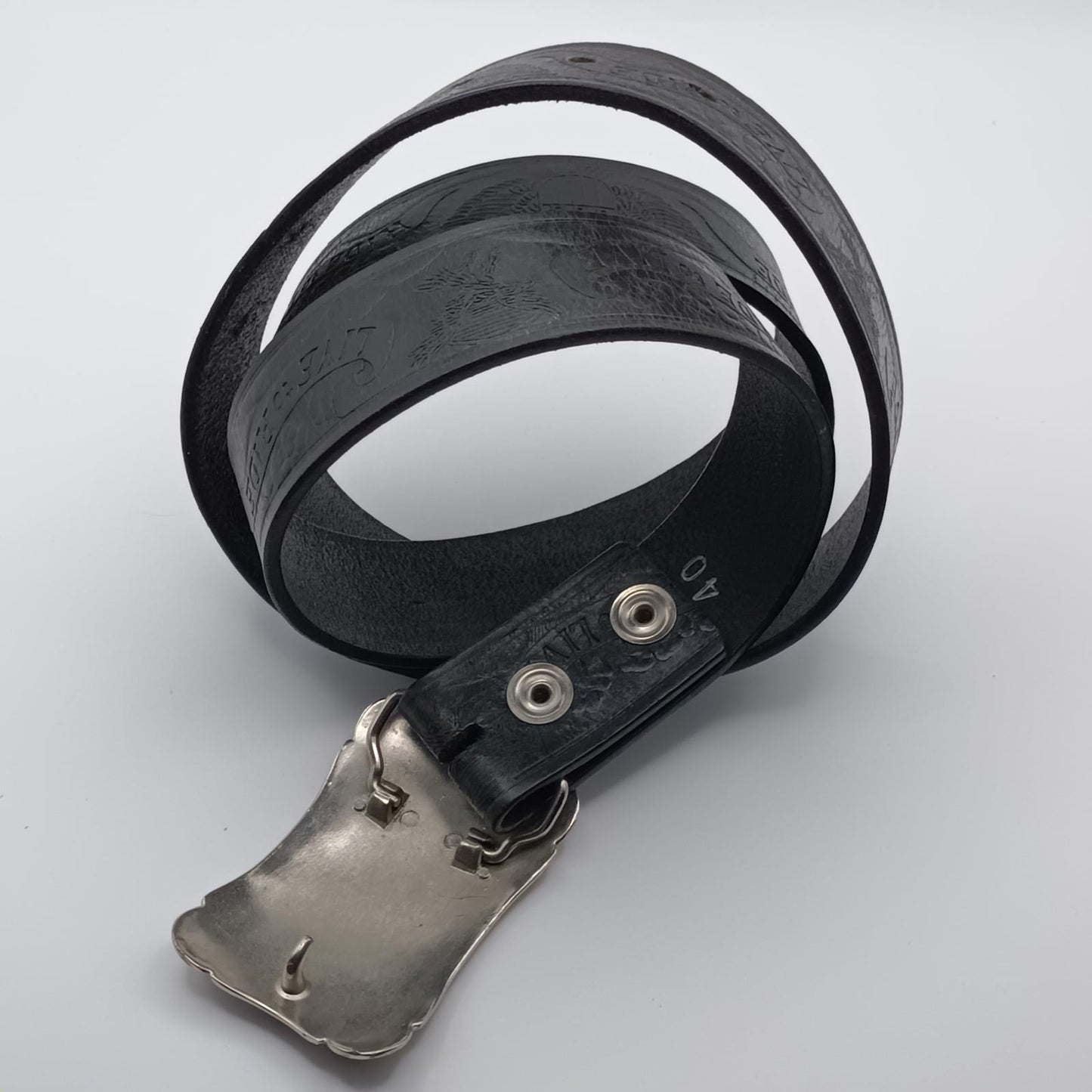 Vintage black tooled leather Live to ride silver buckled belt.