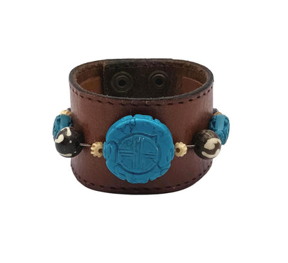 Vintage Handmade brown leather cuff with blue oriental stone embellishments