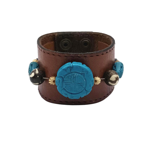 Vintage Handmade brown leather cuff with blue oriental stone embellishments