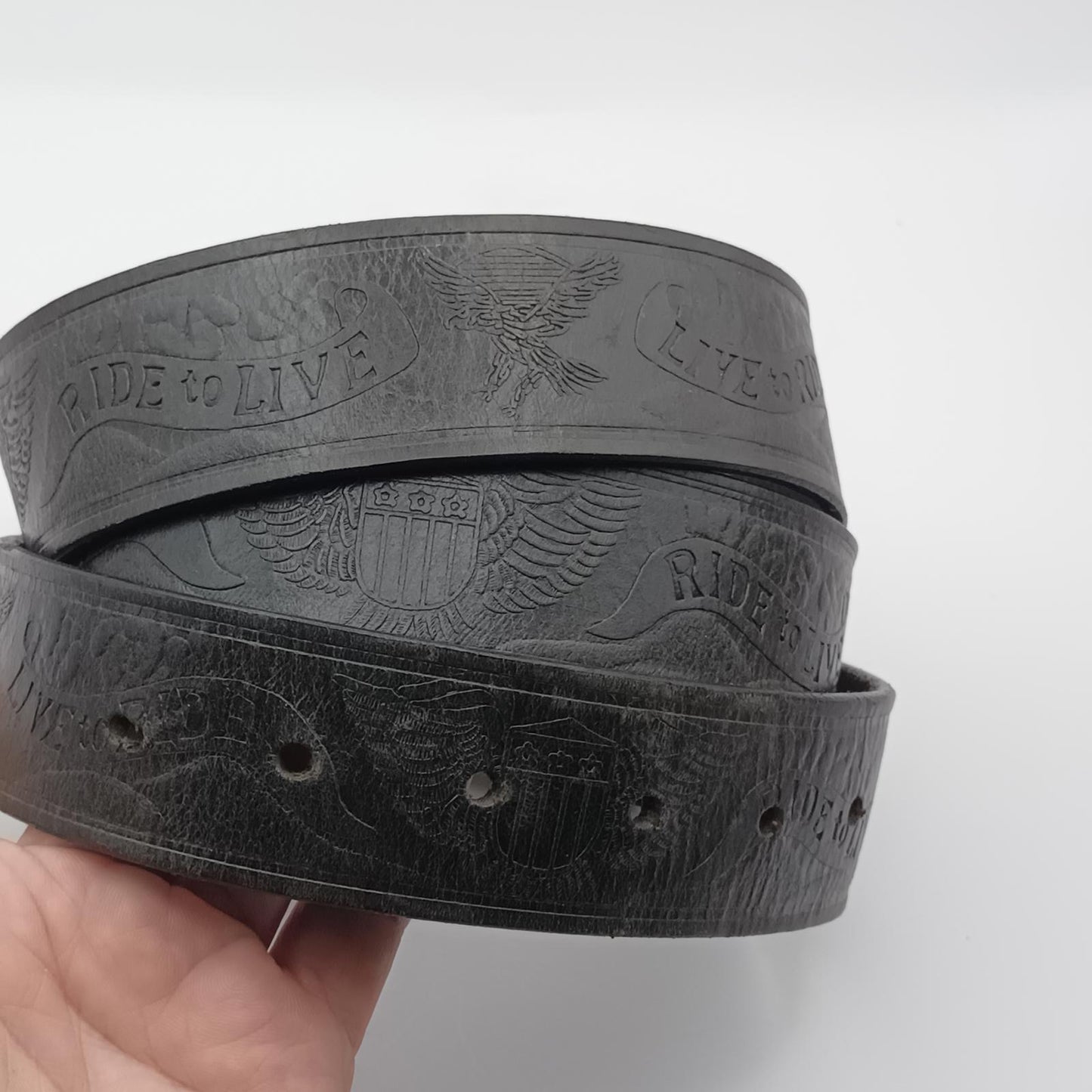 Vintage black tooled leather Live to ride silver buckled belt.