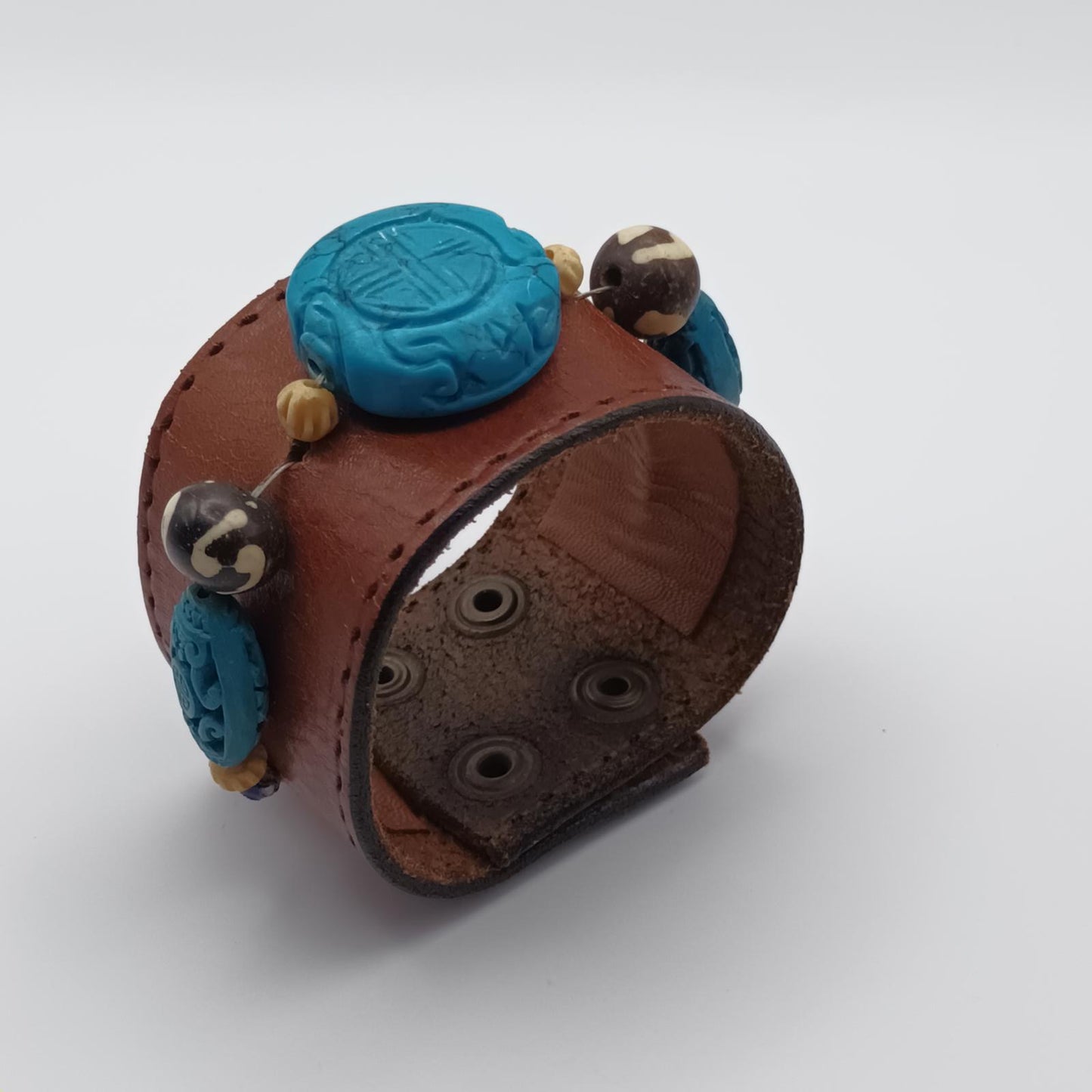 Vintage Handmade brown leather cuff with blue oriental stone embellishments