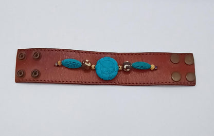 Vintage Handmade brown leather cuff with blue oriental stone embellishments