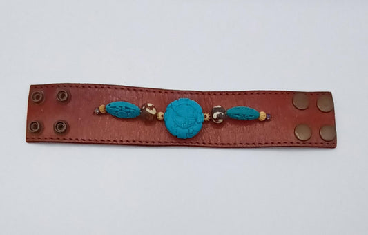 Vintage Handmade brown leather cuff with blue oriental stone embellishments