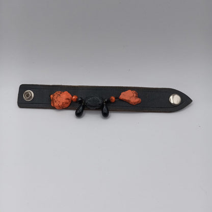 Vintage Handmade black leather cuff with black oriental stone embellishments.